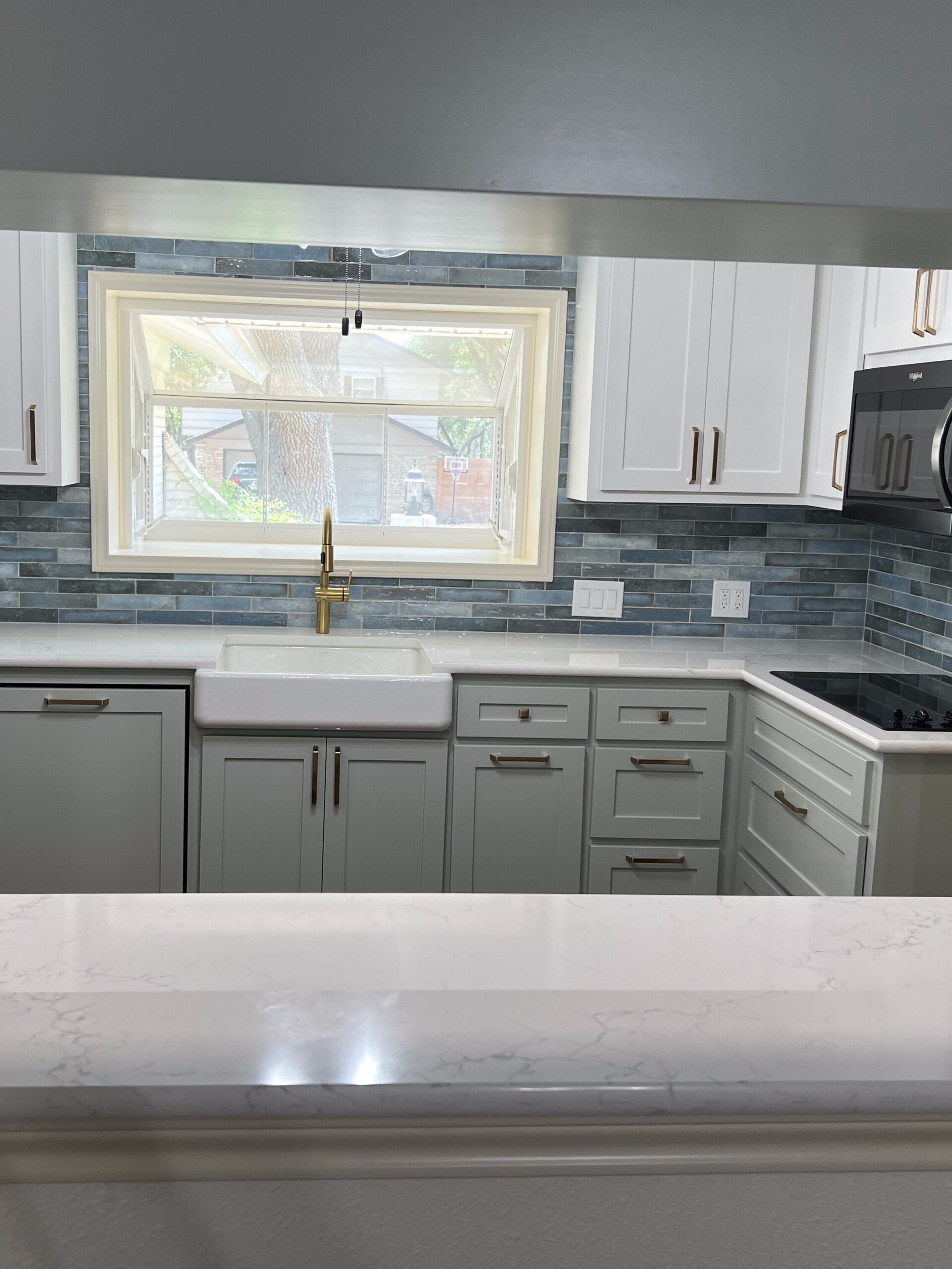 Menchaca Austin kitchen and floor plan remodel with kitchen removal, hardwood flooring, countertops, and baseboards