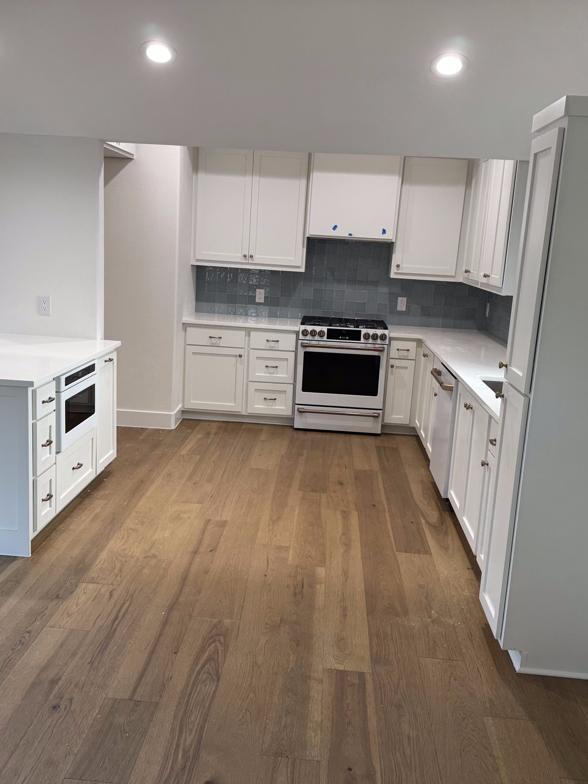Bouldin Austin whole house remodel with structural wall opening, kitchen remodel, flooring, bathroom remodel, and baseboards