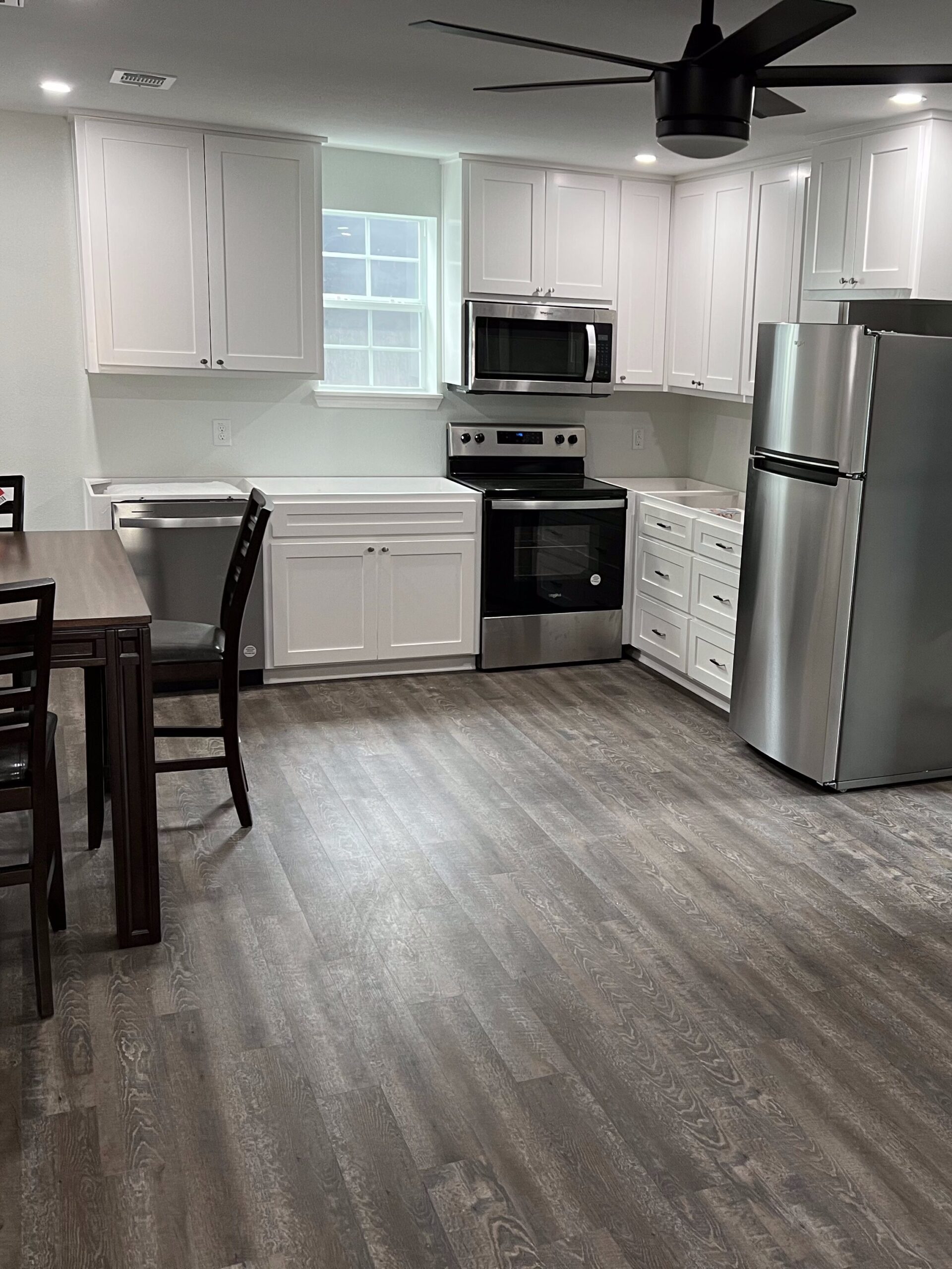 Driftwood barndo living space build-out with AC system, flooring, kitchen, bathroom, and laundry room