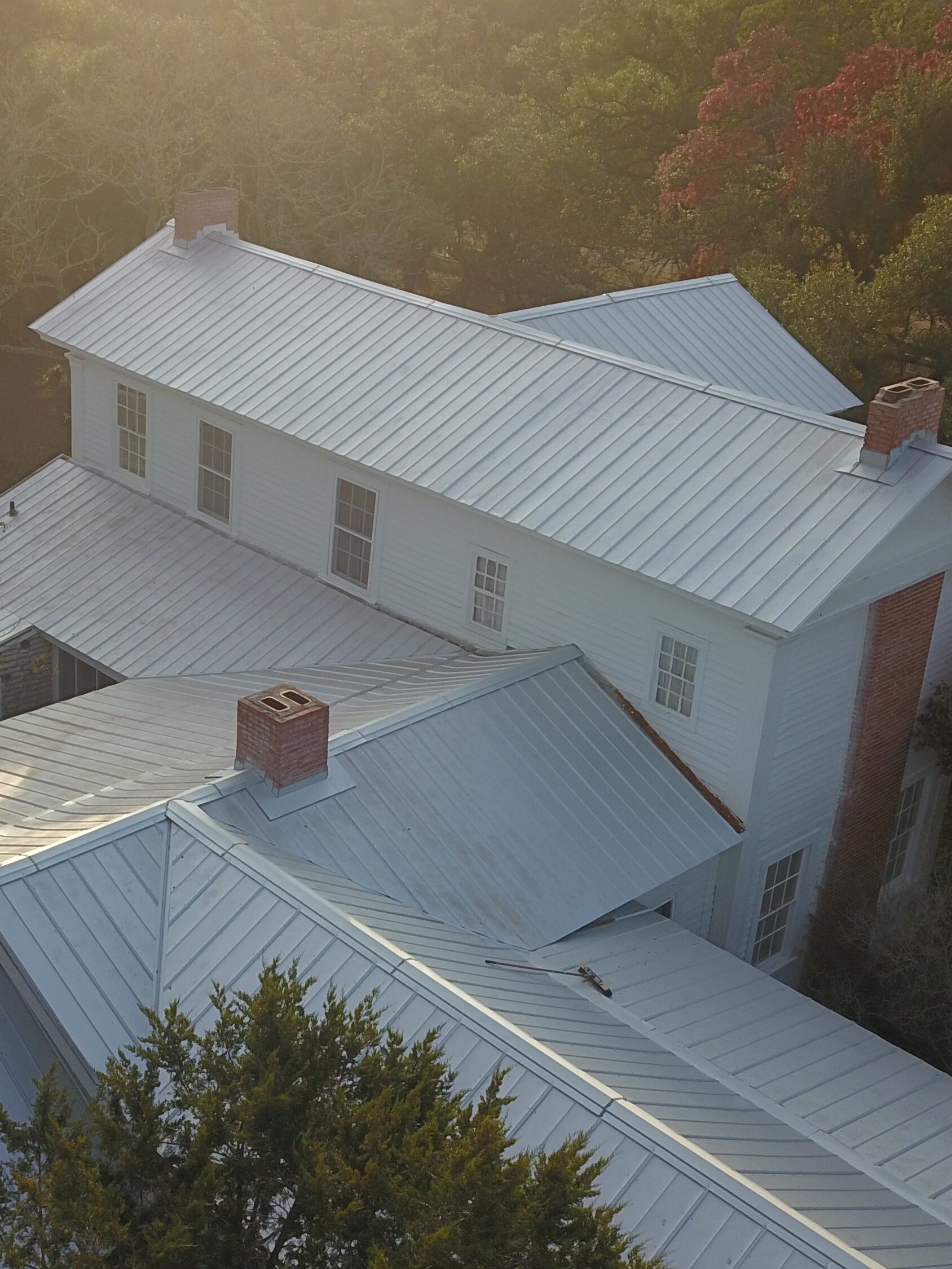 Driftwood historic mansion metal roof replacement with tin roof restoration and chimney flashing