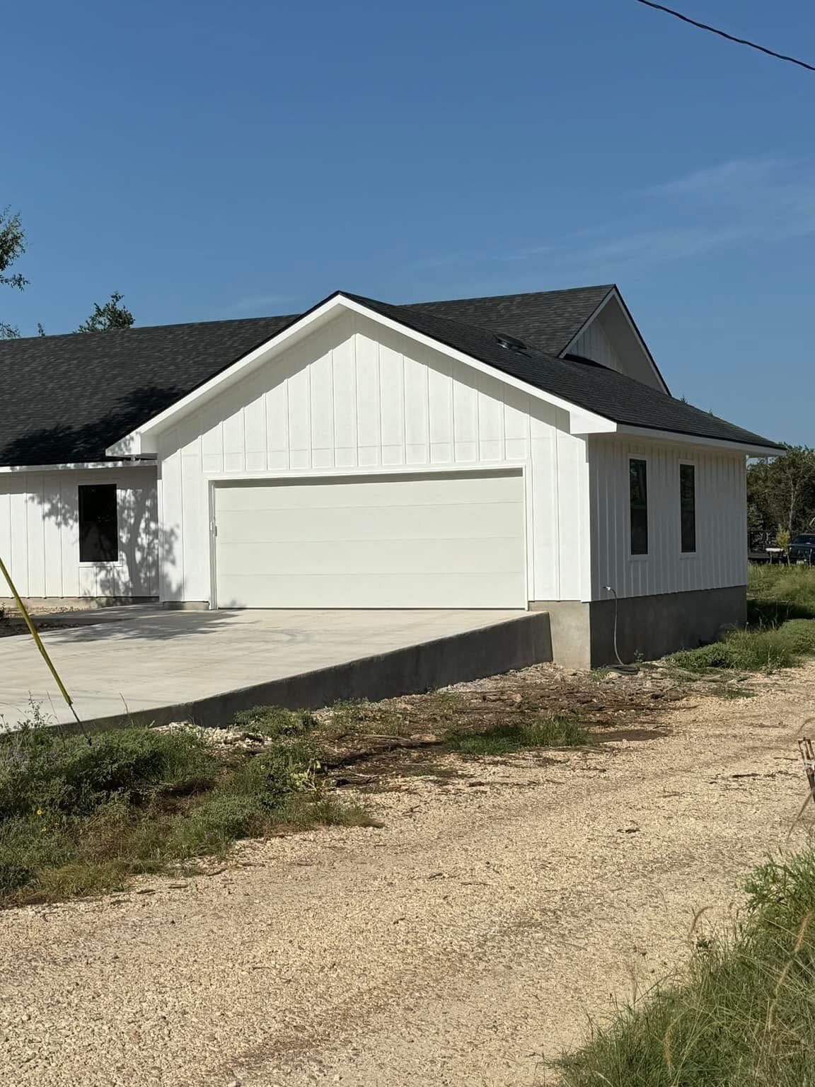 Driftwood Hays County custom home build with framing, exterior construction, and finish carpentry