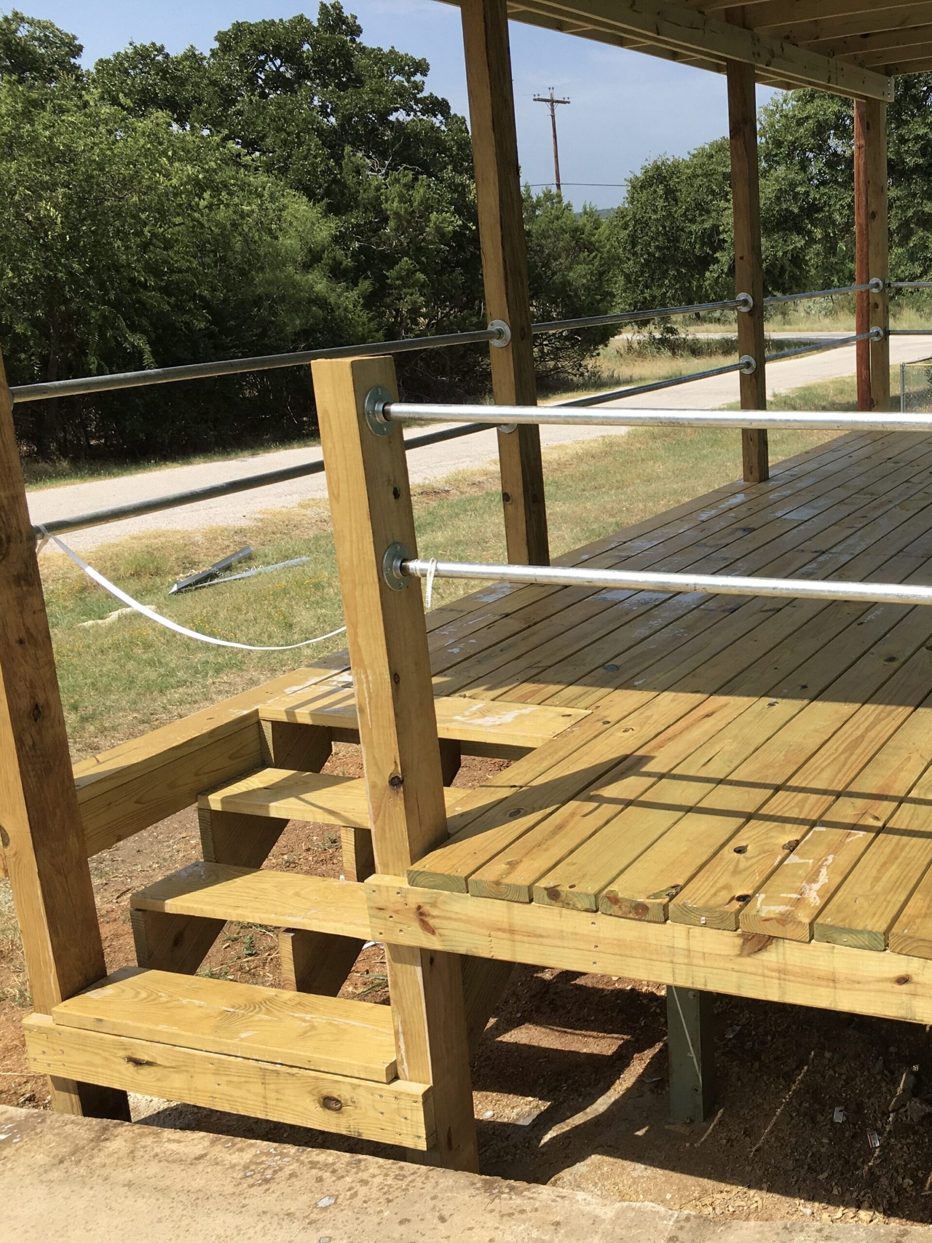 San Marcos outdoor living and concrete project with driveway pour, concrete slab, decking, and exterior carpentry