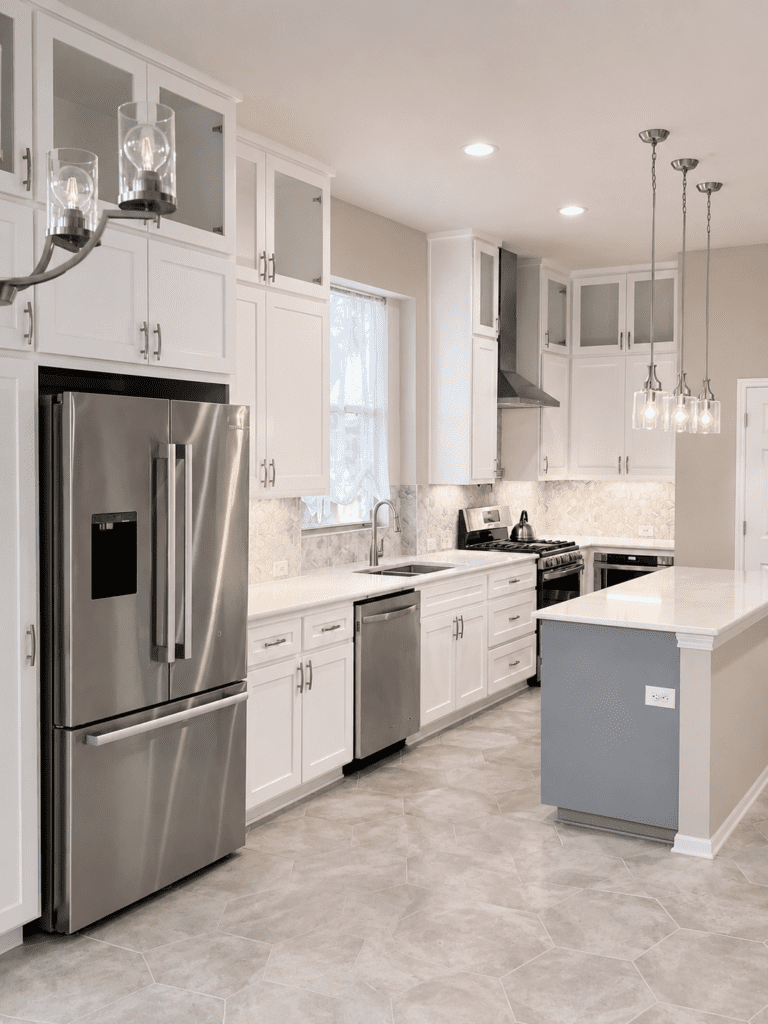 Legend Oaks Austin kitchen remodel after photo with updated cabinets, countertops, backsplash, stainless steel appliances, island, and interior finishes