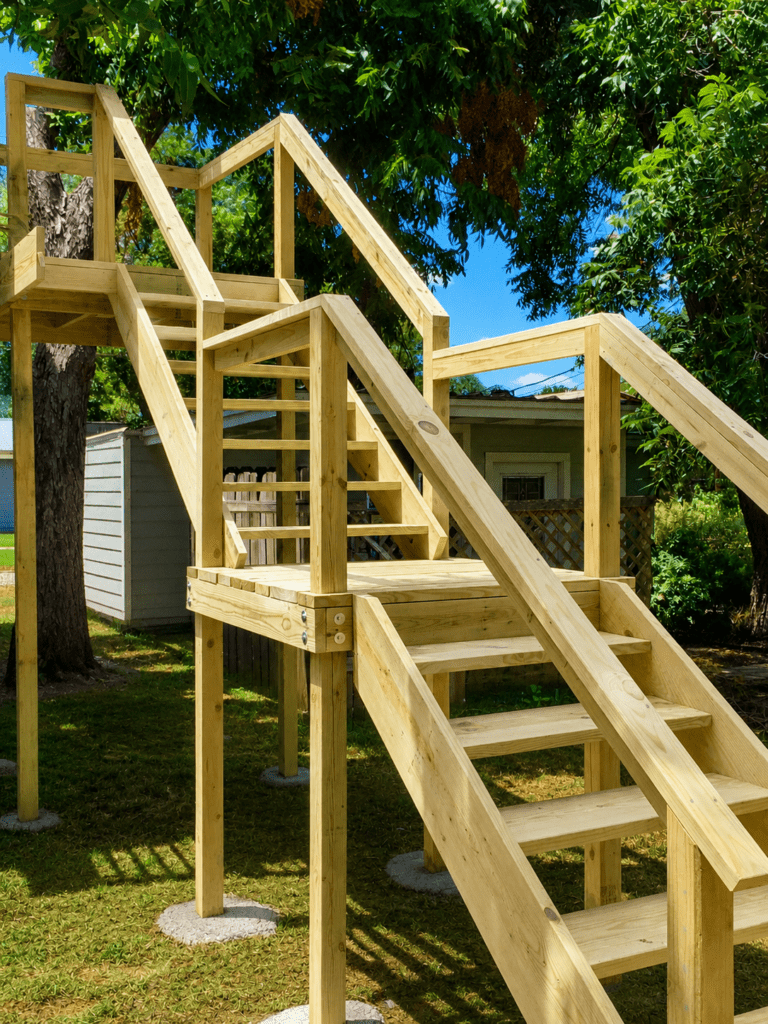 Custom patio addition with exterior wood stairs and deck framing at Lake Lyndon B. Johnson in the Texas Hill Country