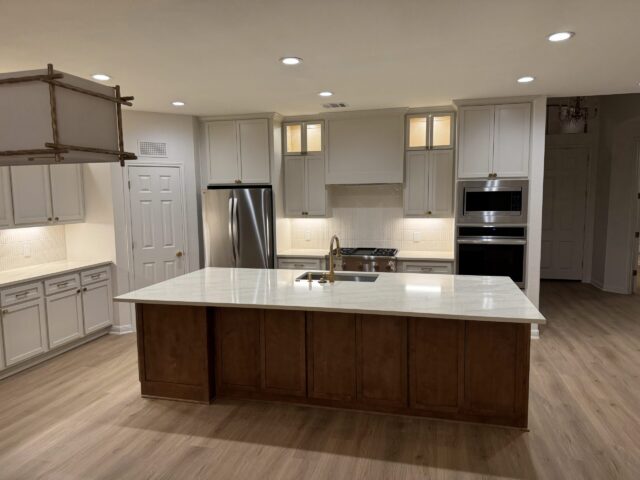 Austin home renovation with updated cabinets, bathroom finishes, and new flooring after remodel